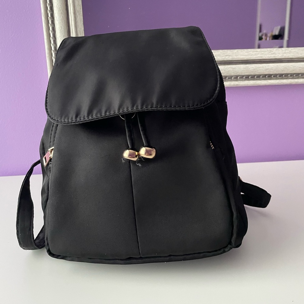 Medium size backpack with cheetah print lining